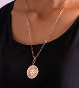 Sun pendant with an adjustable golden chain